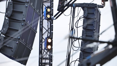 Professional audio line array speakers and stage lighting equipment rigging for outdoor event